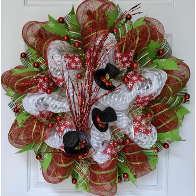Couronne d'hiver avec jet de chapeaux de bonhomme de neige