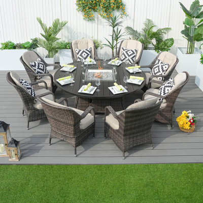 Aquiel Round 8 - Person 128.35" Long Dining Set with Cushions