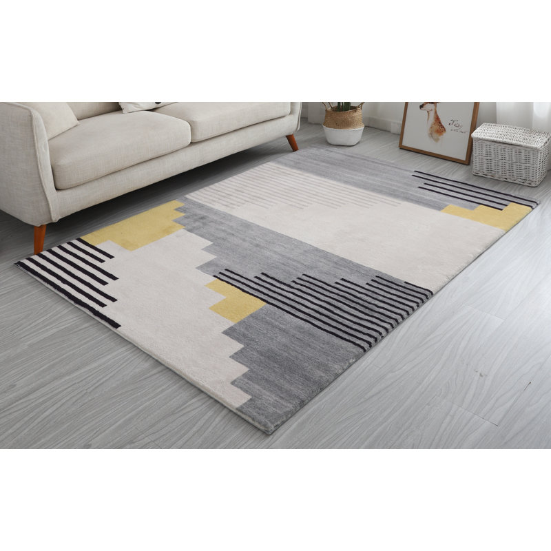 Tapis gris touffeté à la main