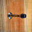 Butée de baseboard de porte laiton