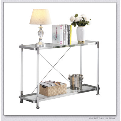 Élégante console en chrome et verre avec pieds en acrylique, parfaite pour les salons et les chambres modernes