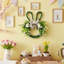 Couronne de lapin de Pâques - Couronne en forme de tête de lapin de 14,5 po avec verdure artificielle et nœud. Décoration de porte mignonne printanière. Décorations de Pâques parfaites pour un mur de ferme, une fenêtre et une maison de vacances
