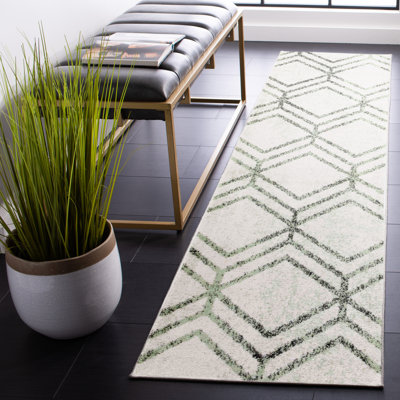 Tapis géométrique ivoire / sauge Arrietty