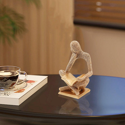 Statue de femme lisant en or scintillant, sculpture de penseuse, ornement d'art abstrait, figurine décorative moderne et esthétique pour la maison, le salon, la chambre à coucher, le bureau, une étagère, une table, un bureau ou une bibliothèque.