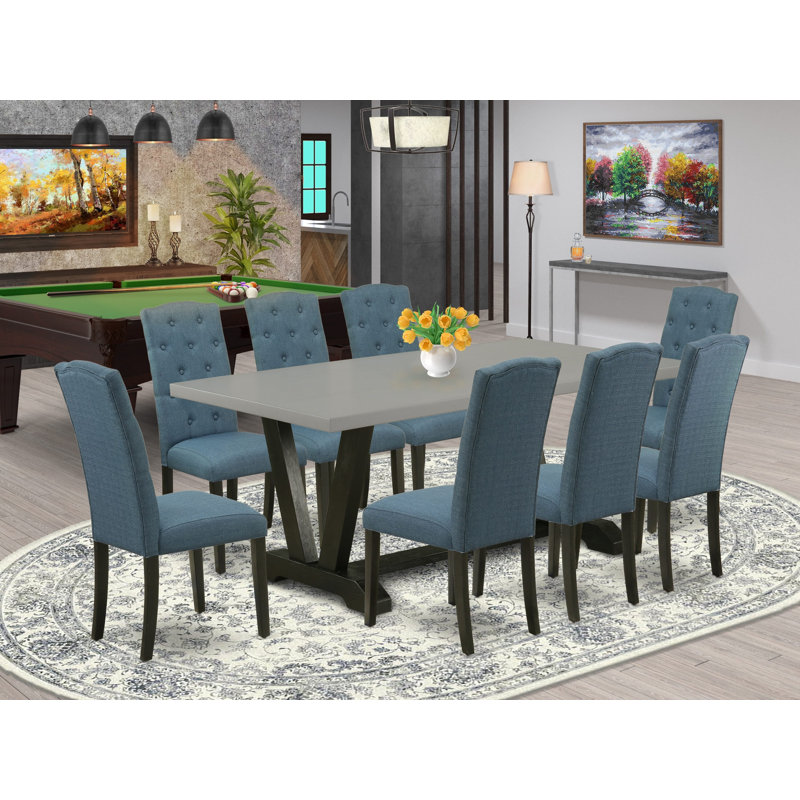 L'ensemble 9 pièces comprend une table rectangulaire en bois avec pieds en V et 8 chaises de salle à manger Parson en tissu bleu minéral, finition noire brossée 