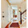 Spiceland Floral Polypropylene Area Rug in Red