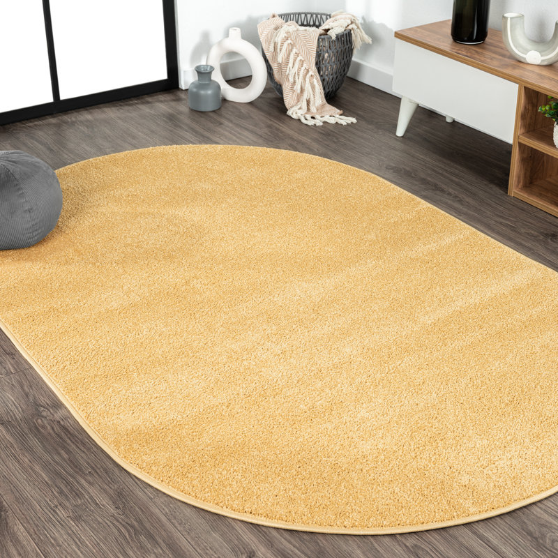 Asako Solid Low-Pile Mustard Rug, Oval 4' x 6'