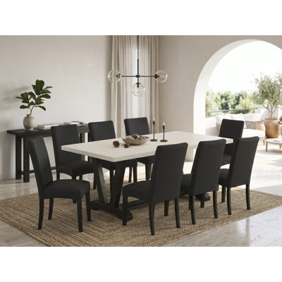 Cet ensemble de salle à manger 9 pièces comprend une table rectangulaire en lin blanc et 8 chaises de cuisine en lin noir avec dossier haut - finition noire brossée