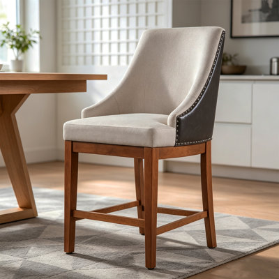 Fauteuil moderne minimaliste en tissu et similicuir avec garniture cloutée