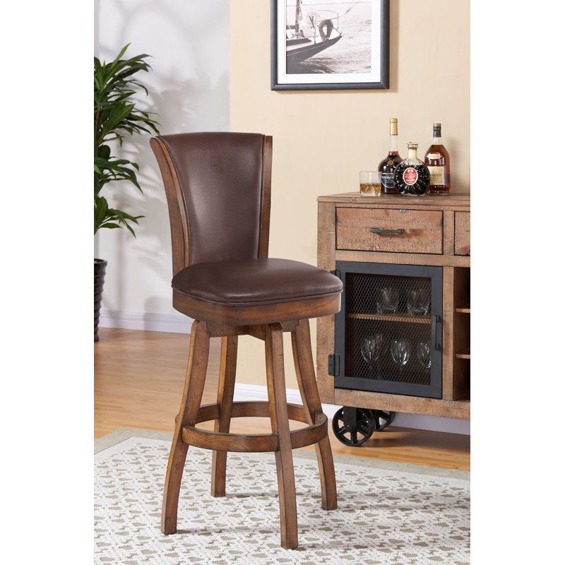 Tabouret de bar / de comptoir pivotant sans accoudoirs en bois et similicuir Shockley, Kahlua, Châtaigne