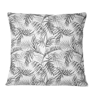 Coussin décoratif à motif de feuilles de palmier noir et blanc sur fond blanc
