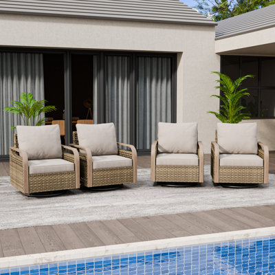 Chaise berçante d'extérieur en osier pivotant avec coussins