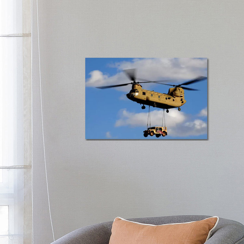 A US Army CH-47 Chinook Helicopter Transports A Humvee by Stocktrek Images - Wrapped Canvas Print