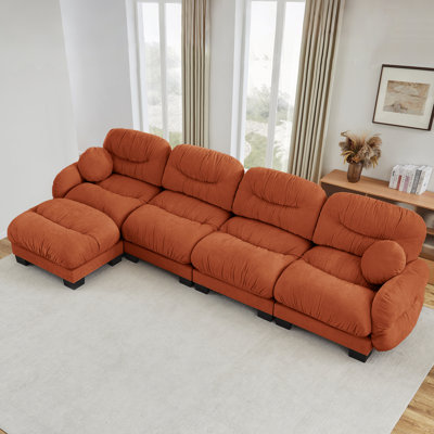 Canapé modulaire en L plissé en chenille 4 places avec mousse ergonomique, accoudoirs courbés, repose-pieds et coussins décoratifs pour un confort ultime et une disposition flexible.