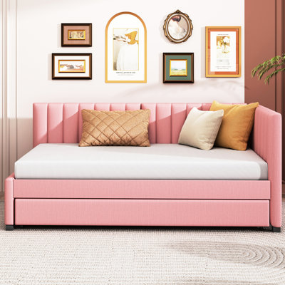 Lit de jour rembourré en tissu rose avec lit gigogne simple, sans sommier tapissier requis