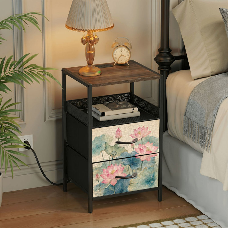 Table de chevet avec station de recharge intégrée, 2 tiroirs, ports USB et prises électriques, tablette ouverte, noire, motif aquarelle de fleurs et feuilles de lotus.