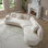 Canapé modulaire courbé minimaliste de 128 po à 5 places avec oreilles de papillon et dossier modulaire blanc