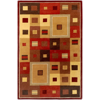 Tapis en laine touffeté et fabriqué à la main à motif géométrique rouge / caramel Mcquaid