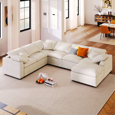 Canapé modulaire 7 places avec repose-pieds mobile