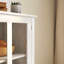 Armoire de rangement polyvalente avec portes doubles en verre et poignées en cloche uniques pour les maisons modernes