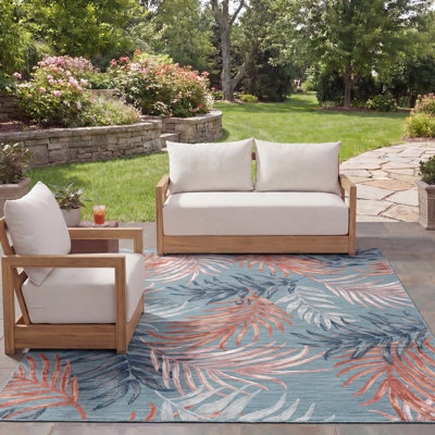 Tapis intérieur / extérieur à motif floral bleu / rouille Afeez