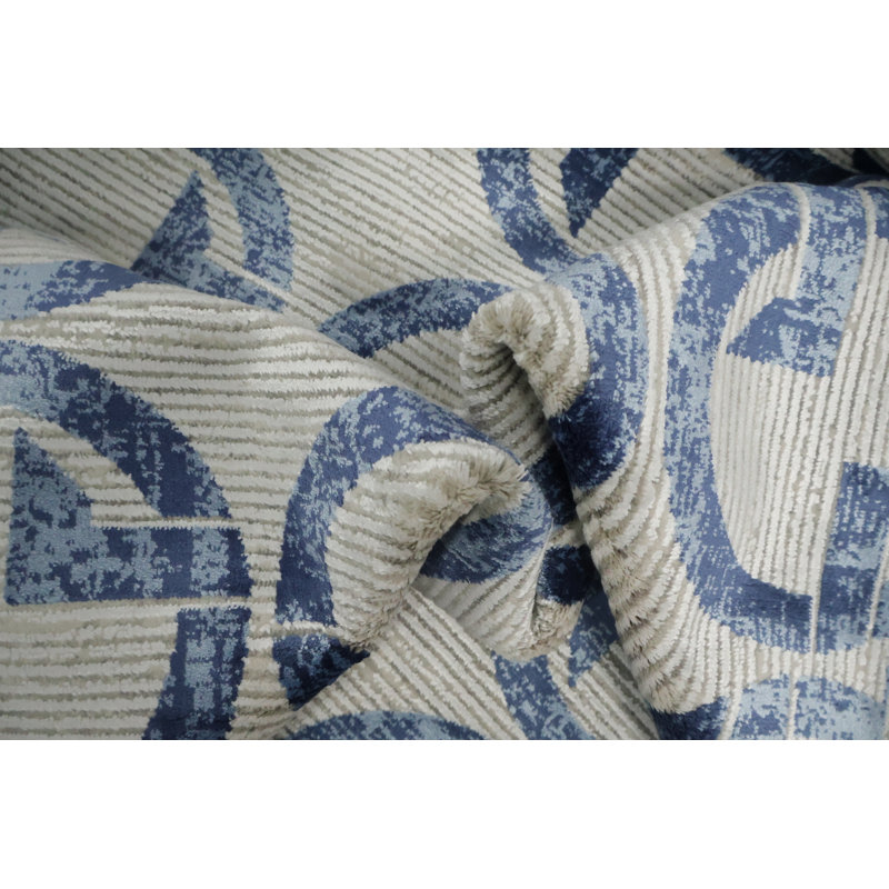 Tapis sophistiqué à motif de cercles dans des tons de bleu doux 5 x 8