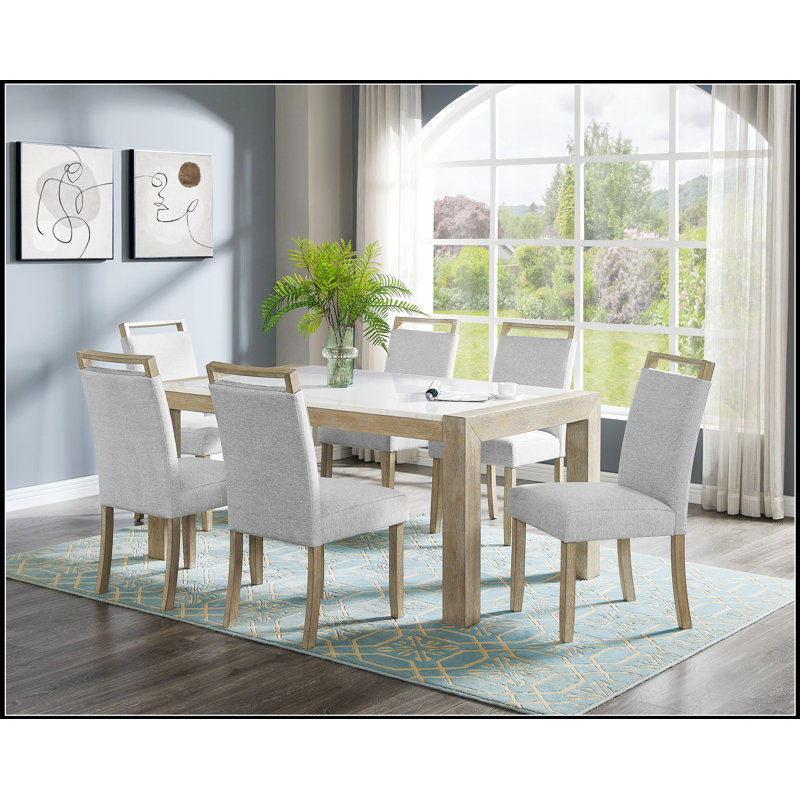 Ensemble de salle à manger contemporain de 7 pièces avec table en marbre véritable et chaises rembourrées à dossier complet, idéal pour les expériences culinaires élégantes.