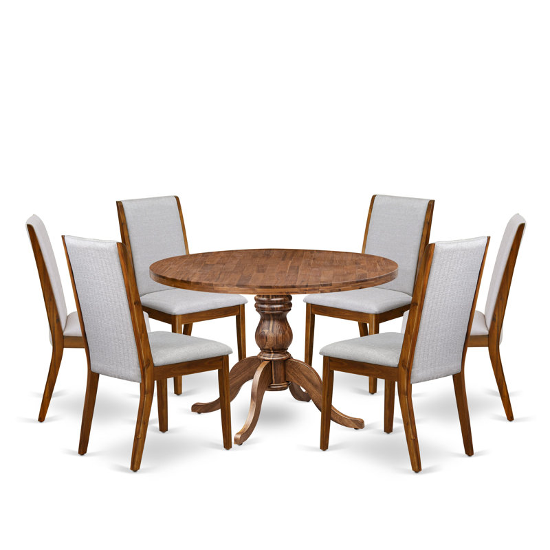 L'ensemble de salle à manger 7 pièces se compose d'une table ronde à piédestal et de 6 chaises en tissu de lin gris avec dossier haut - finition noyer antique