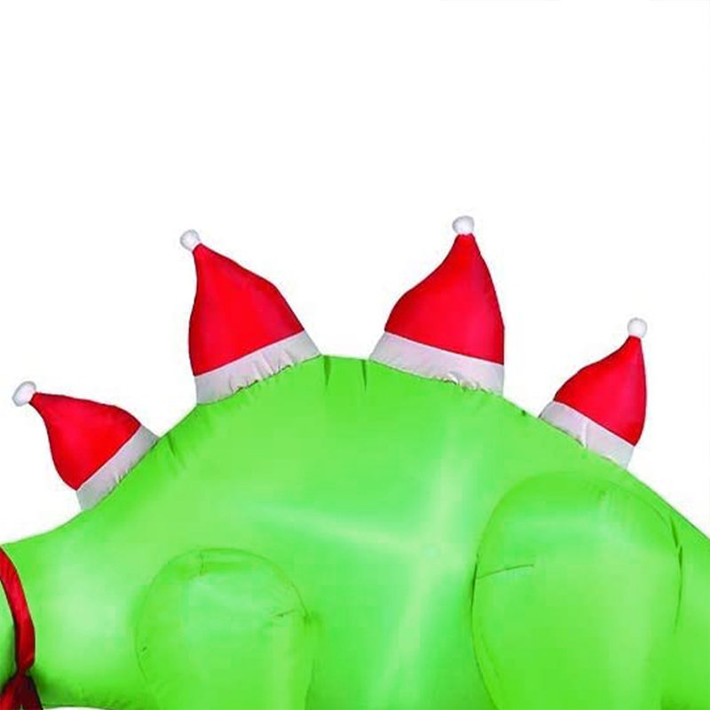 Stégosaure avec chapeaux de père Noël gonflables