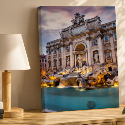 Toile une vue majestueuse de la fontaine de Trevi à Rome au crépuscule, mettant en vedette une architecture baroque complexe avec des sculptures ornées