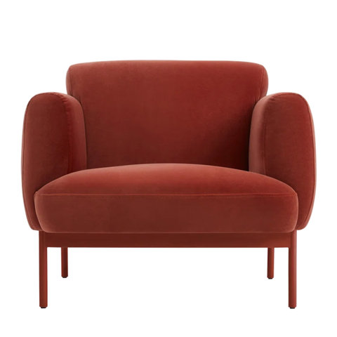 Upholstered burnt-orange armchair.