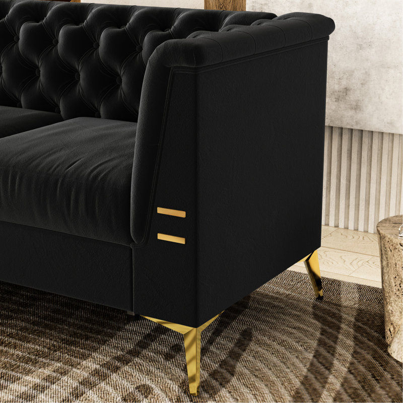 Velours noir avec des pieds dorés et un design élégant