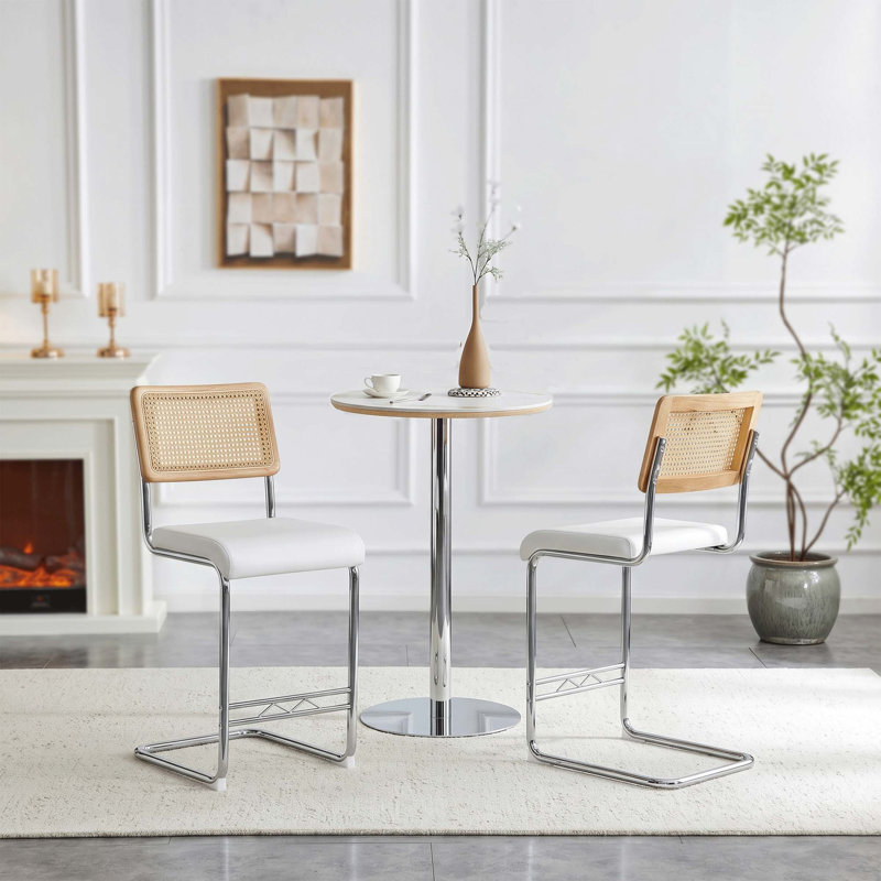 Ensemble de table de bar moderne en pierre frittée avec tabourets en faux rotin