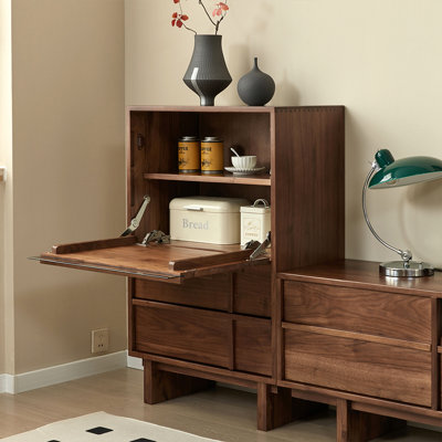 A mid-style solid wood chest of drawers