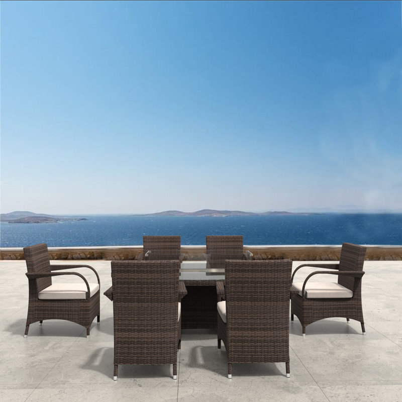 Arnould 6 - Person Wicker Patio Dining Set with Oval Table , Cushions Included