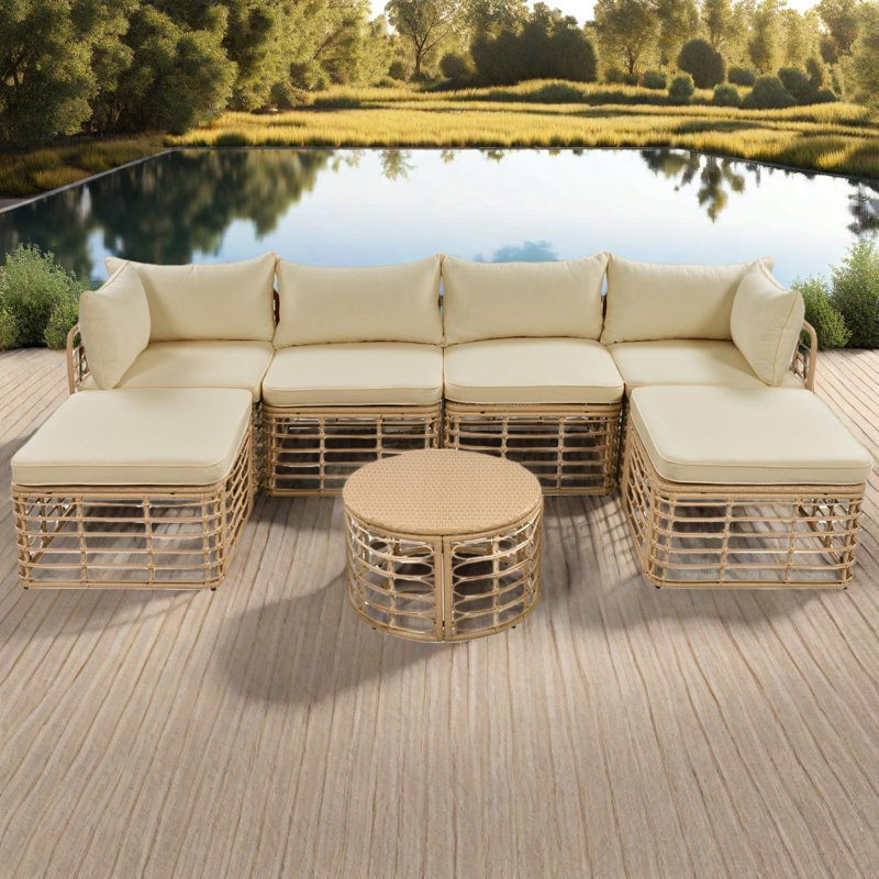 Ensemble de canapé modulaire d'extérieur en osier 7 pièces avec coussins, repose-pieds et table basse ronde en polyéthylène 7 pièces