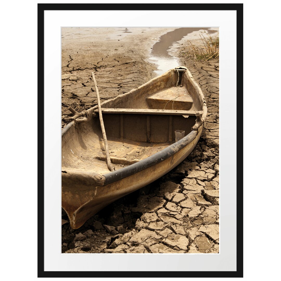 Gerahmter Fotodruck Boat in a Dried-Up Lake