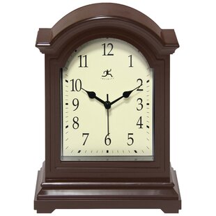 https://assets.wfcdn.com/im/30344500/resize-h310-w310%5Ecompr-r85/1495/149550995/analog-quartz-tabletop-clock-in-dark-brown.jpg