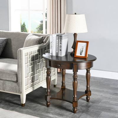 Bunnlevel 24" Tall Oval Wood End Table with Storage by World Menagerie