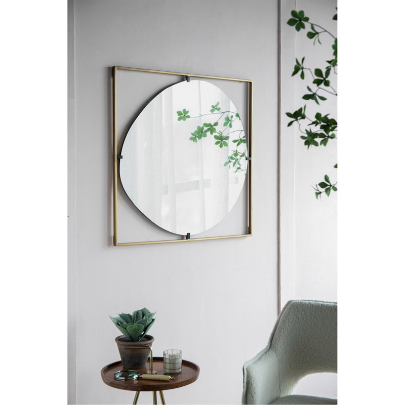 Miroir de salle de bain élégant avec un design abstrait et un cadre en métal durable