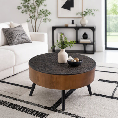 Table basse sculptée ronde avec rangement