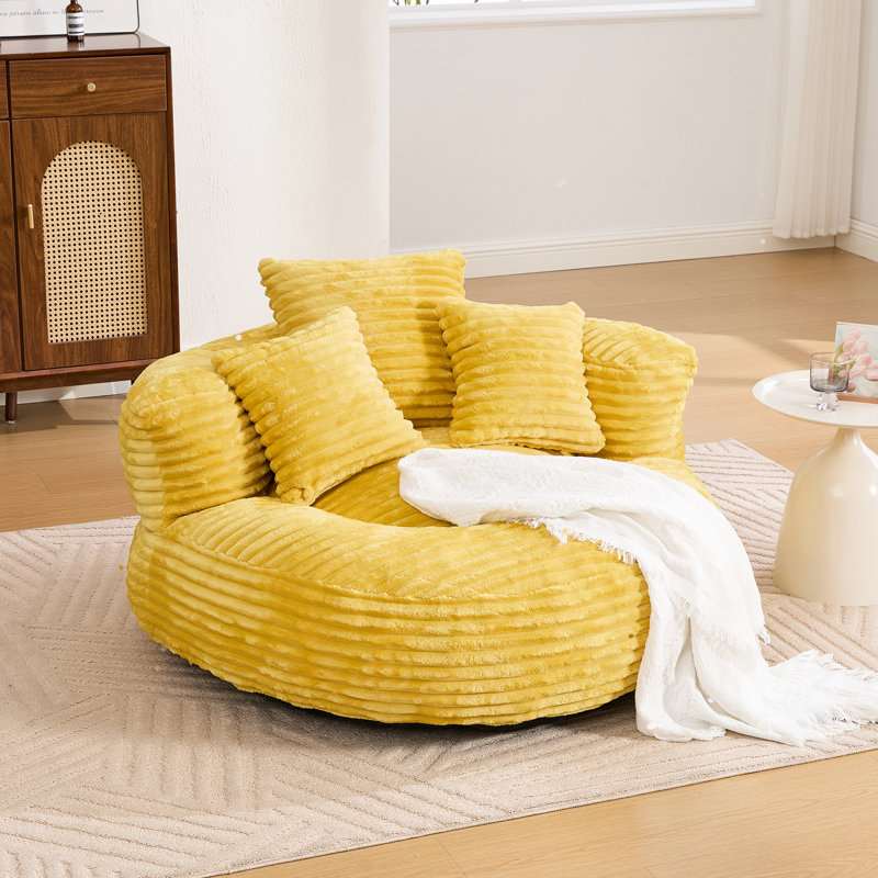 Pouf poire pour la lecture dans la chambre, en velours côtelé doux, avec dossier haut et design surdimensionné offrant un soutien ergonomique. Trois coussins inclus, idéal pour des après-midi de détente.