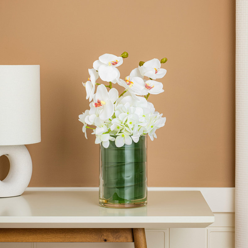 Orchidée blanche artificielle 11 po dans un pot en verre.
