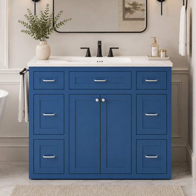Meuble-lavabo bleu marine 48 po avec lavabo en céramique - 6 tiroirs (3 de chaque côté), tiroir central rabattable, portes doubles à fermeture en douceur, porte-serviettes latéral réversible, poignées argentées, panneau de fibres à densité moyenne