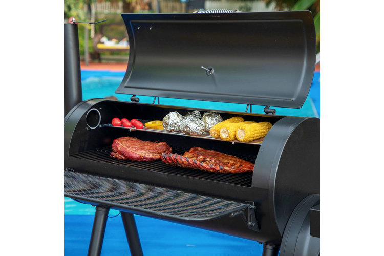 offset smoker open to reveal barbecue cooking inside