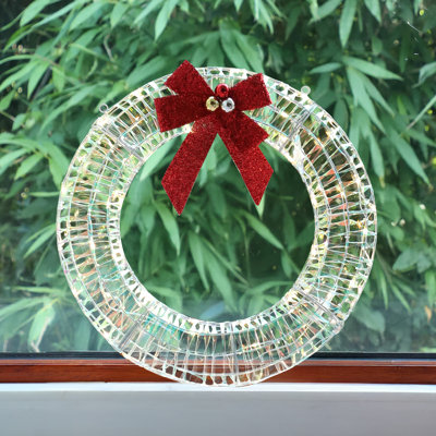 Couronne de Noël irisée 24 po avec nœud rouge