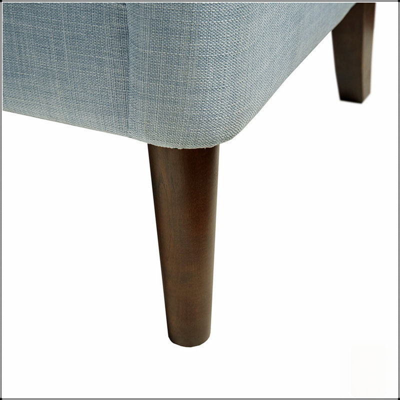 Fauteuil d'appoint capitonné à boutons, offrant une assise confortable et un design élégant, idéal pour les salons et les bureaux à domicile.
