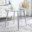 Table de salle à manger Chawki avec plateau en verre et pieds en métal-111861566-107235699