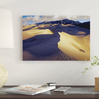 " Rippled Sand Dunes With Sangre De Cristo Mountains In The Background, Great Sand Dunes National Park And Preserve, Colorado " by Tim Fitzharris