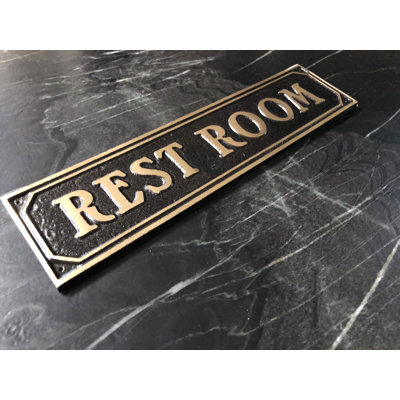 Plaque de porte de toilettes